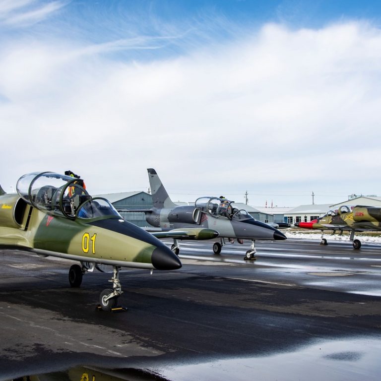 L-39 group Photo of three L-39 Aircraft parked on a tarmac with snow in the background.