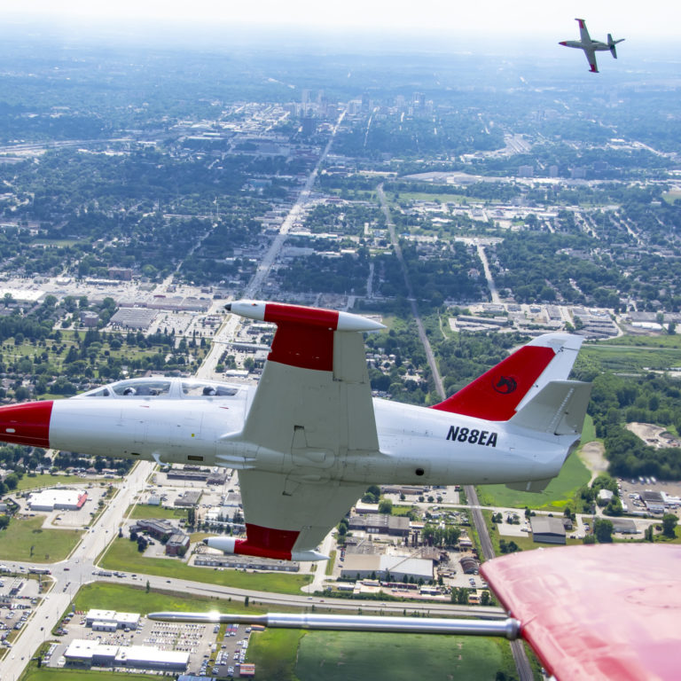 Manuevering with L-39 Photo of three L-39 Aircraft flying in formation over London Canada