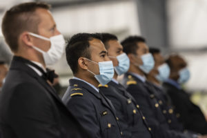 Photo of Royal Malaysian Air Force students wearing masks at a graduation ceremony.
