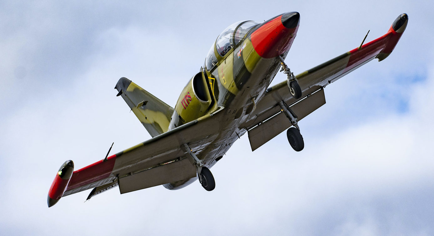 L-39 in flight Photo of green camoflauge L-39 jet aircraft flying with wheels down.