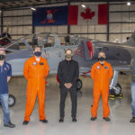 itps20211260090 (1) ITPS Team with Billie Flynn and grey jet in the background in London Canada