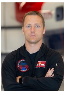 Photo of man in black flying suit