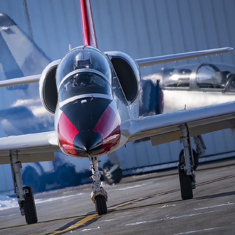 photo of twp L-39 aircraft taxining to runway