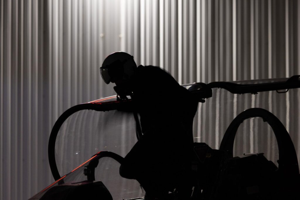 y (2) Pilot entering L39 cockpit for night flying operation