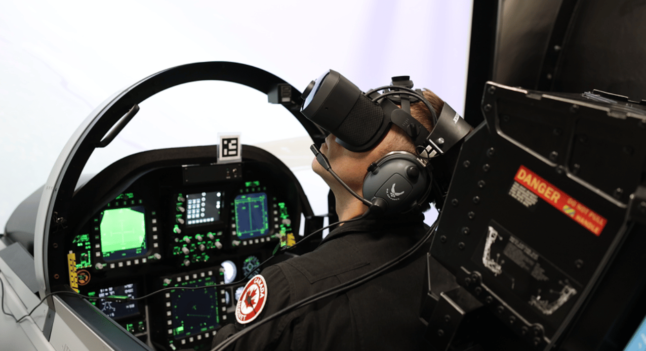 3 Brendan Pierce in F18 cockpit wearing Mixed Reality goggles