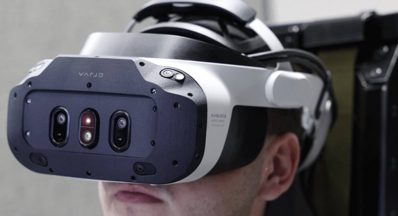 6 student wearing Mixed Reality goggles in aircraft jet simulator