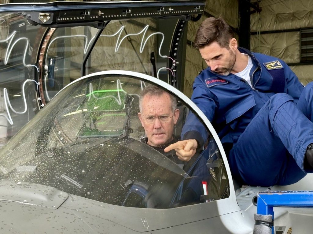 1779809223988 Dave Lohse in cockpit of Leonardo Aeronautics M-346 Block 20 AJT, with Leonardo pilot pointing to cockpit displays