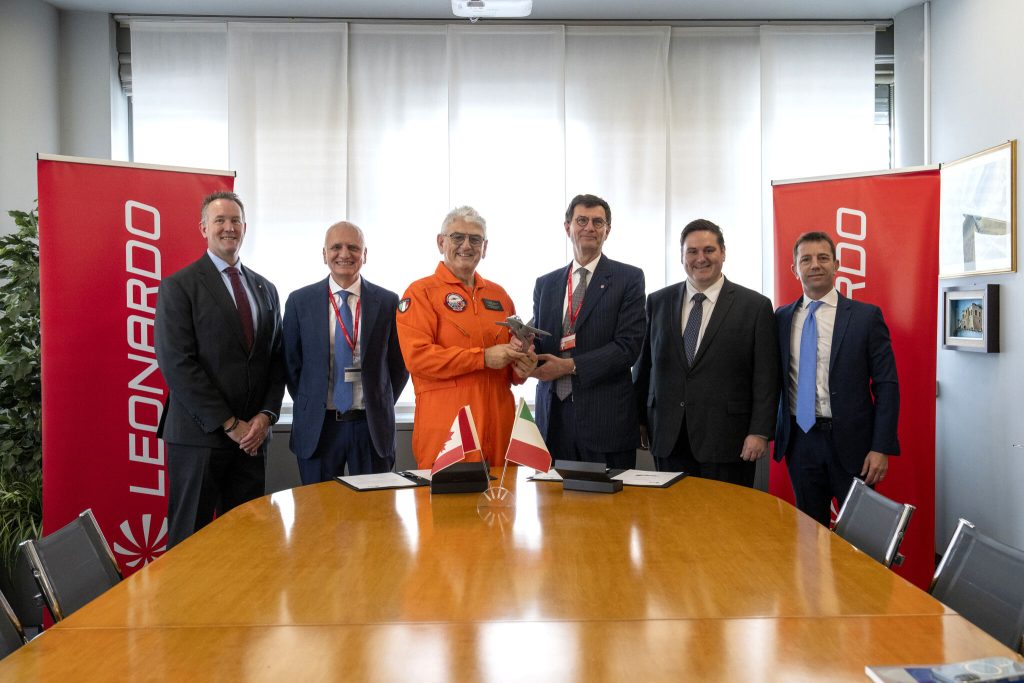 1779809225869 Dave Lohse, Giorgio Clementi, Carlo Clementi with Leonardo staff shaking hands
