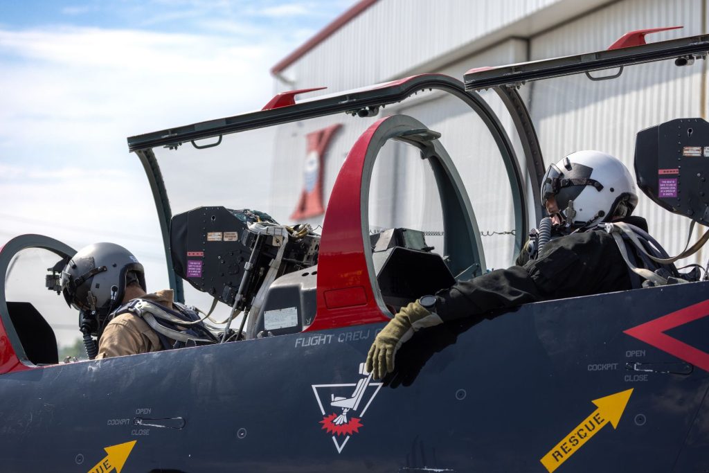 1783111563738 ITTC instructors in L39 cockpit in front of ITPS hangar