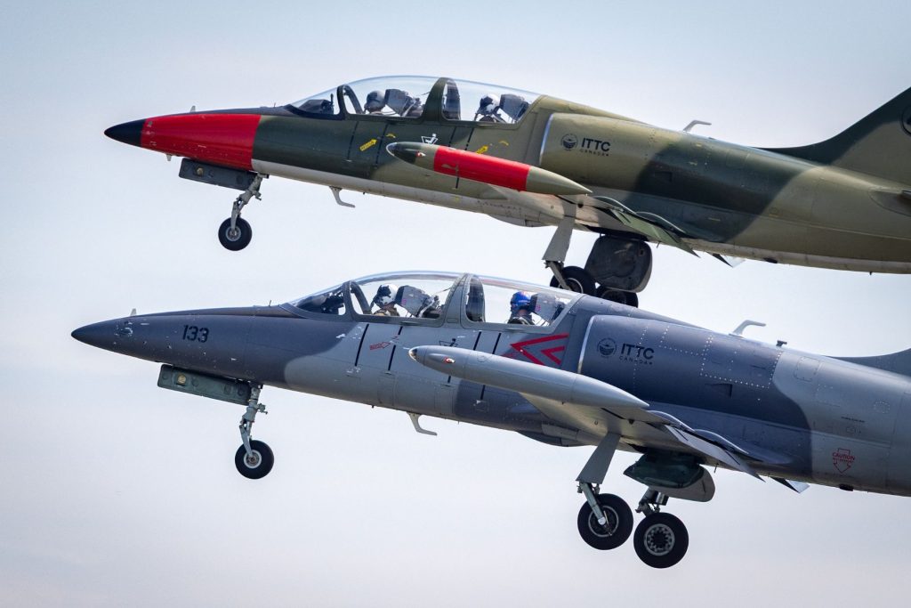 1783111563849 Grey and Green L39s take off together in air
