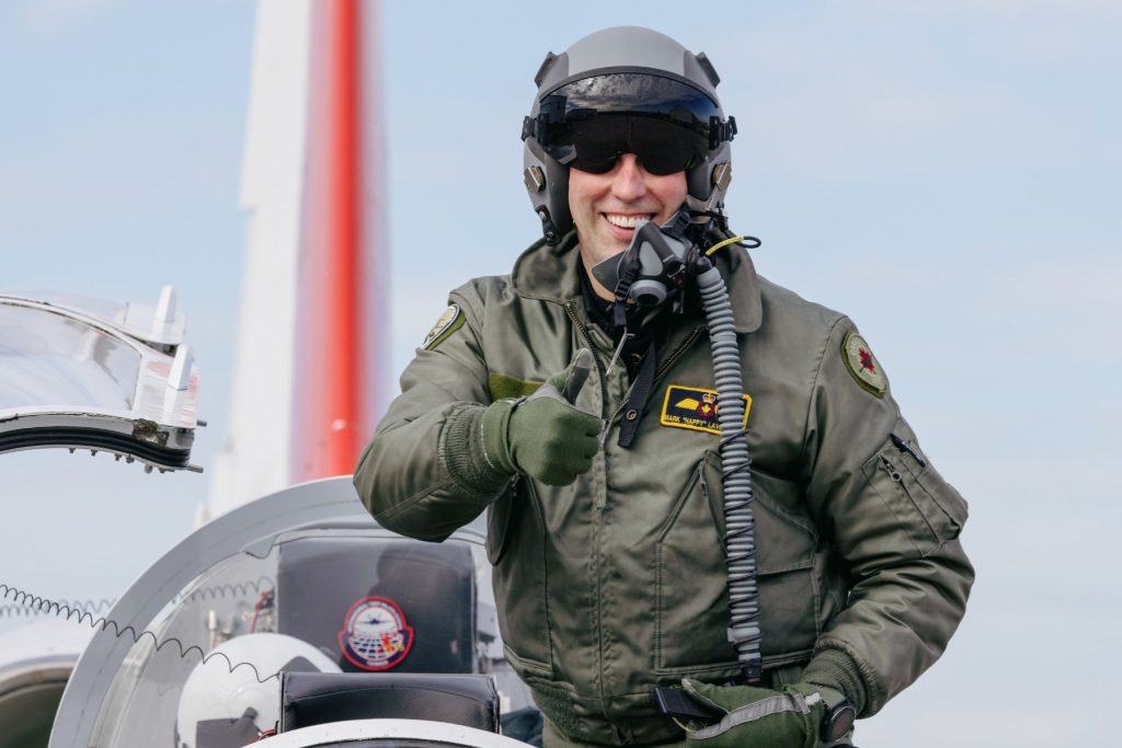 Tactical Instructor pilot smiling, giving thumbs up