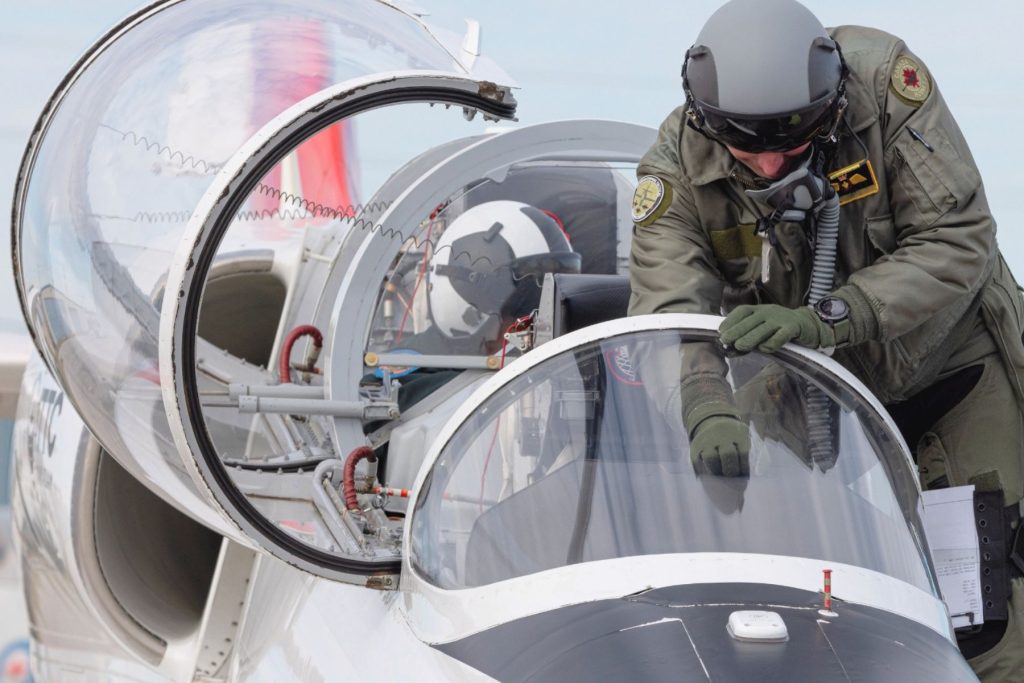 tactical instructor pilot climbing into L39 cockpit