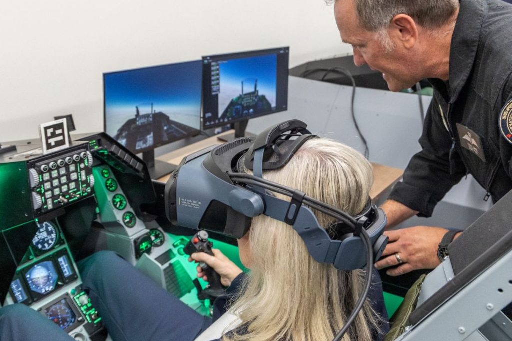 6 Dave Lohse guiding a guest in a simulator with mixed reality
