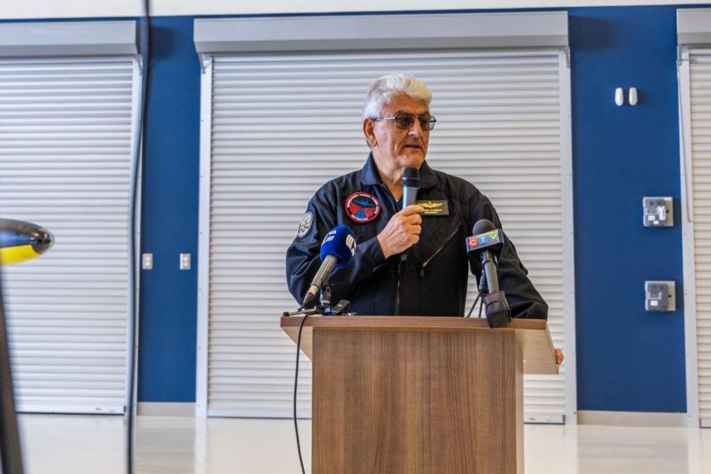 7 Giorgio Clementi speaking at podium in hangar